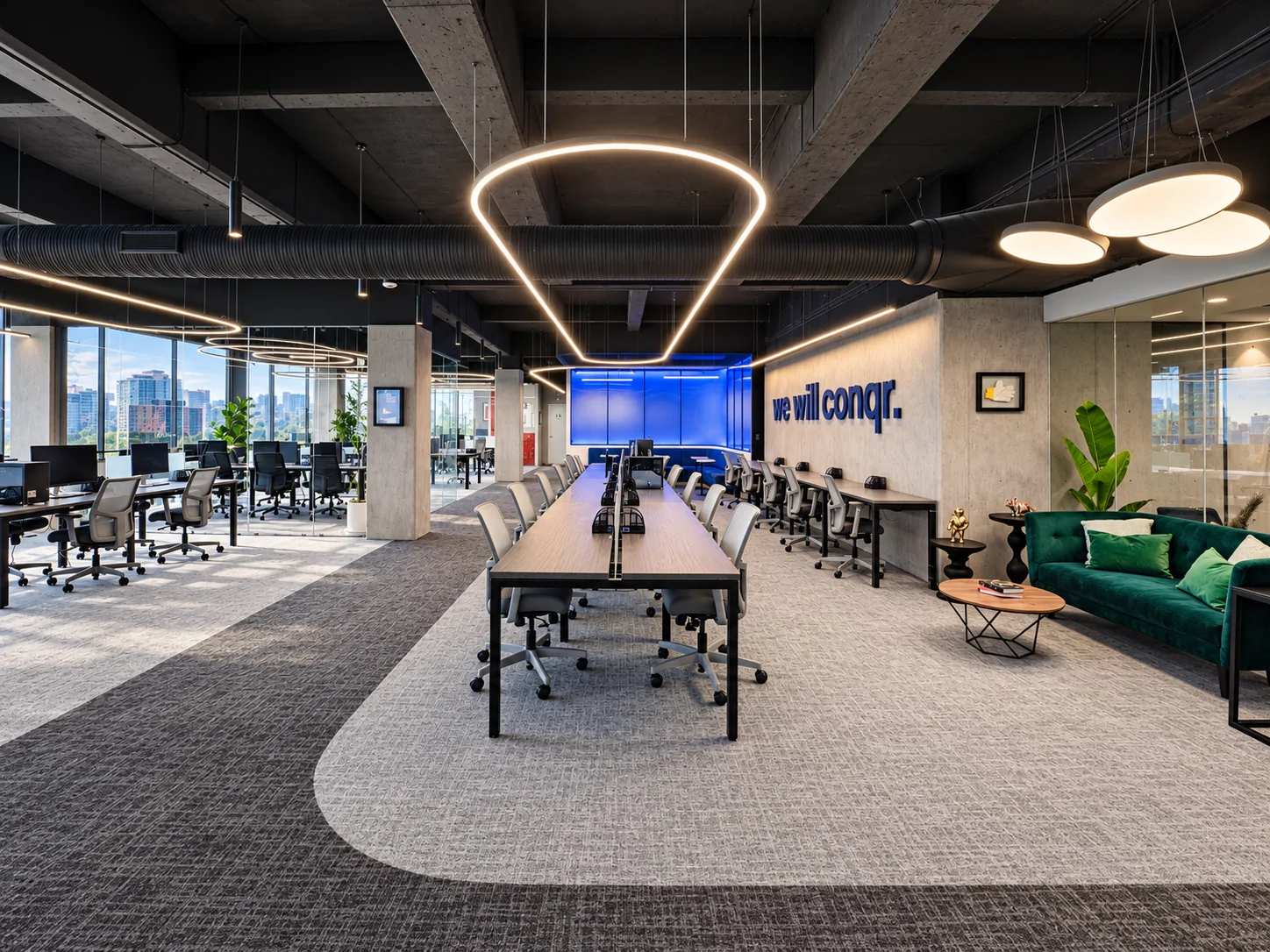 Open-plan conqr. office with long shared desks, circular lights and a blue wall that reads “we will conqr.”